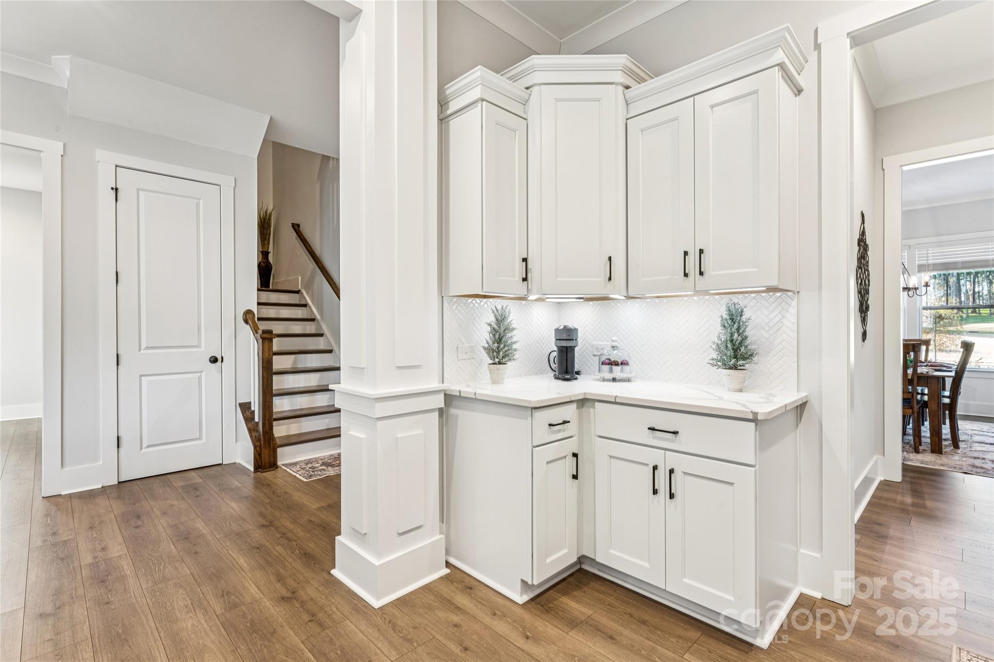7822 Russell Road Indian Trail, NC 28079 - Photo 12 of 48 a kitchen with white cabinets and white appliances