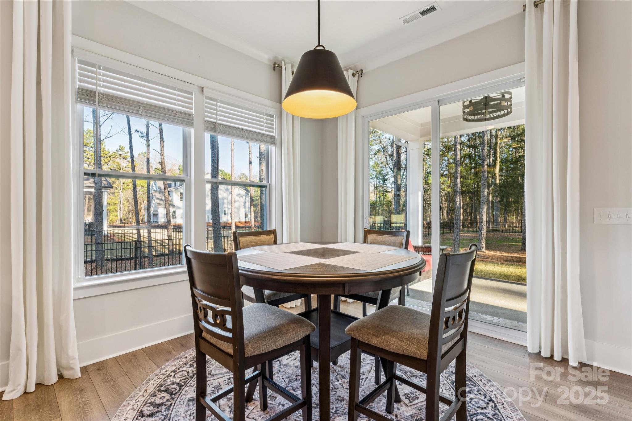 7822 Russell Road Indian Trail, NC 28079 - Photo 16 of 48 a dining room with furniture and a chandelier