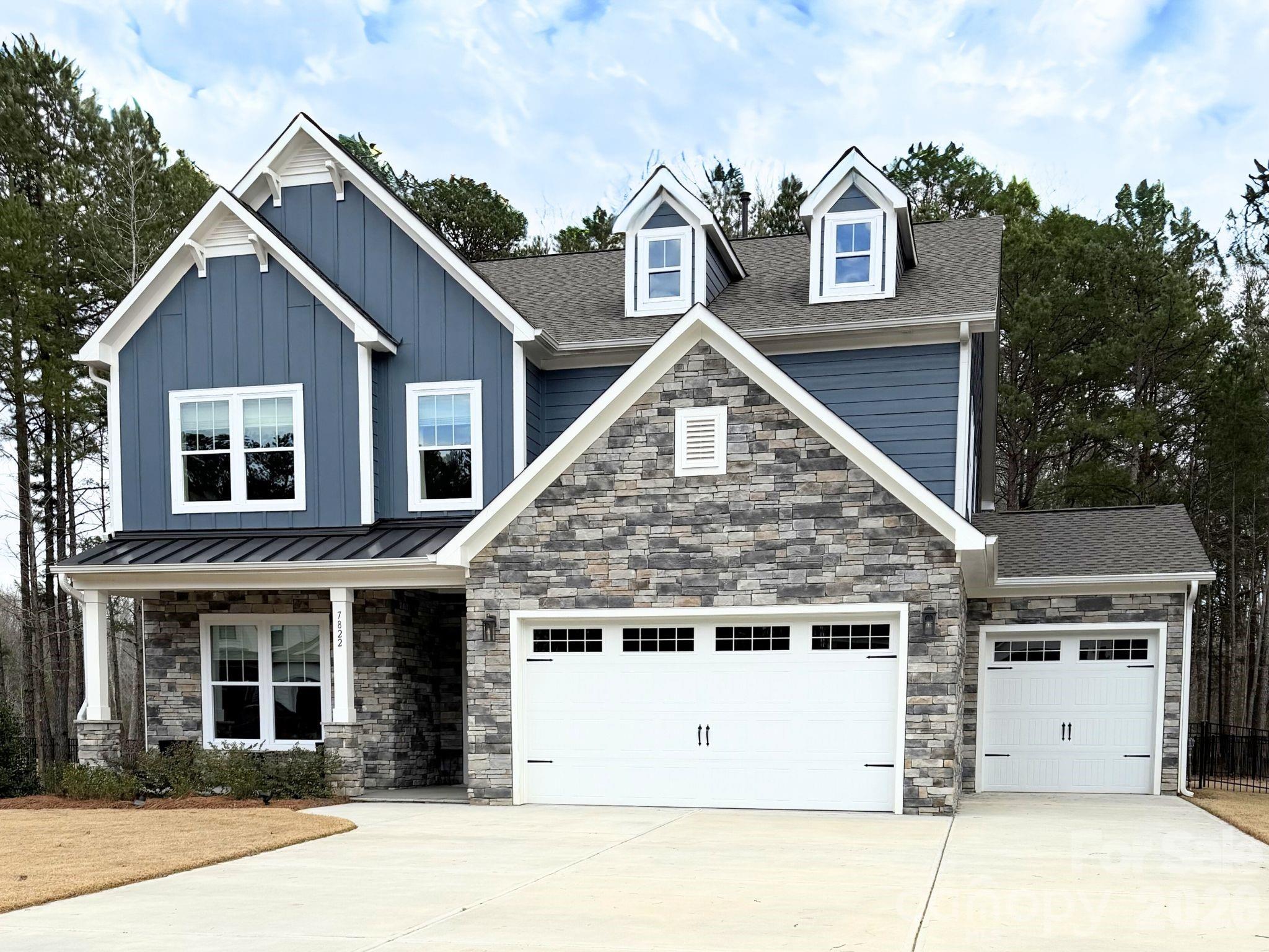 7822 Russell Road Indian Trail, NC 28079 - Photo 2 of 48 a front view of a house with a garage