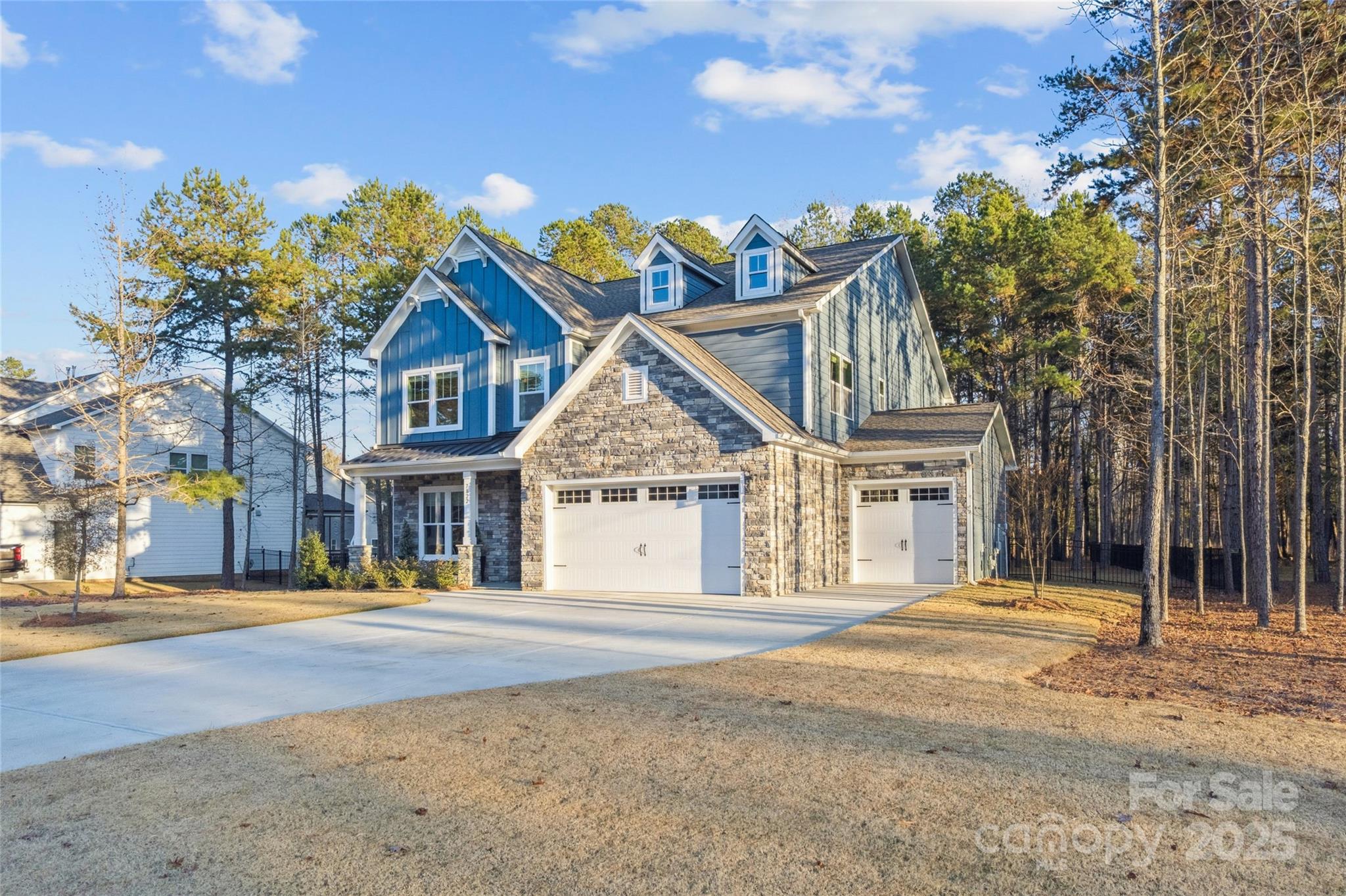 7822 Russell Road Indian Trail, NC 28079 - Photo 2 of 48 a front view of a house with a garden