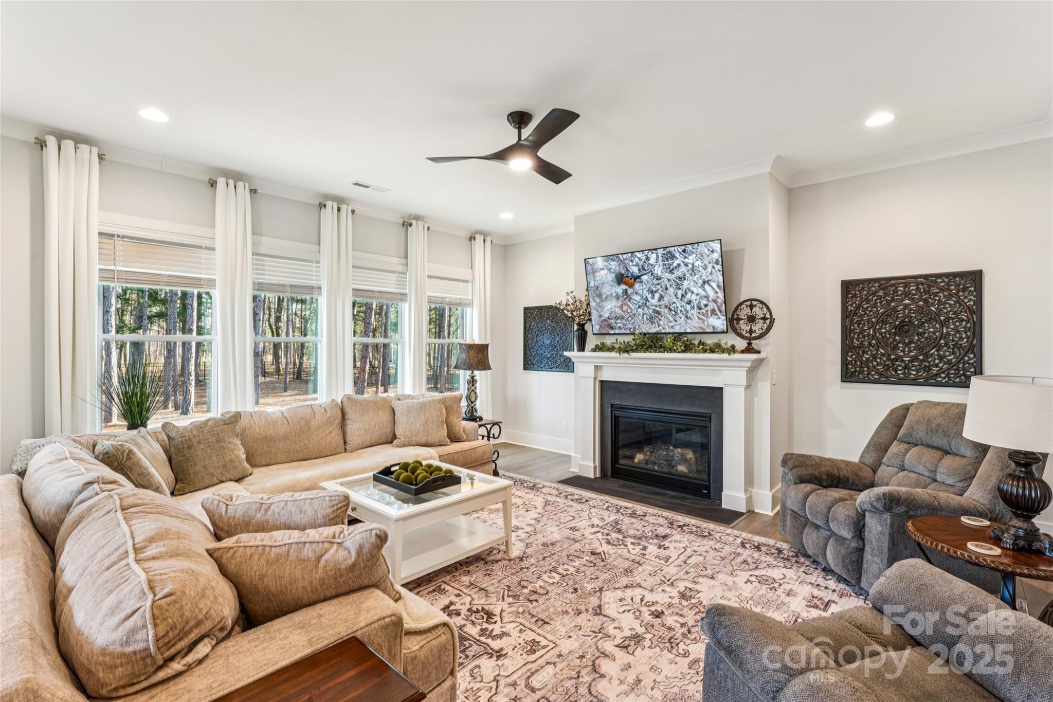 7822 Russell Road Indian Trail, NC 28079 - Photo 21 of 48 a living room with furniture large window and a fireplace