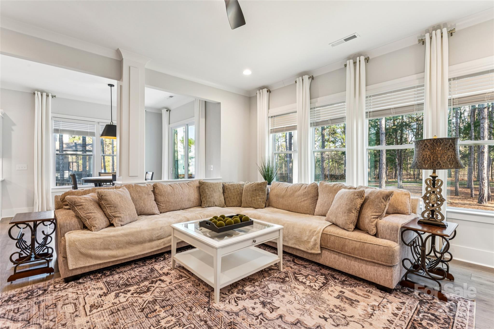 7822 Russell Road Indian Trail, NC 28079 - Photo 22 of 48 a living room with furniture and large windows