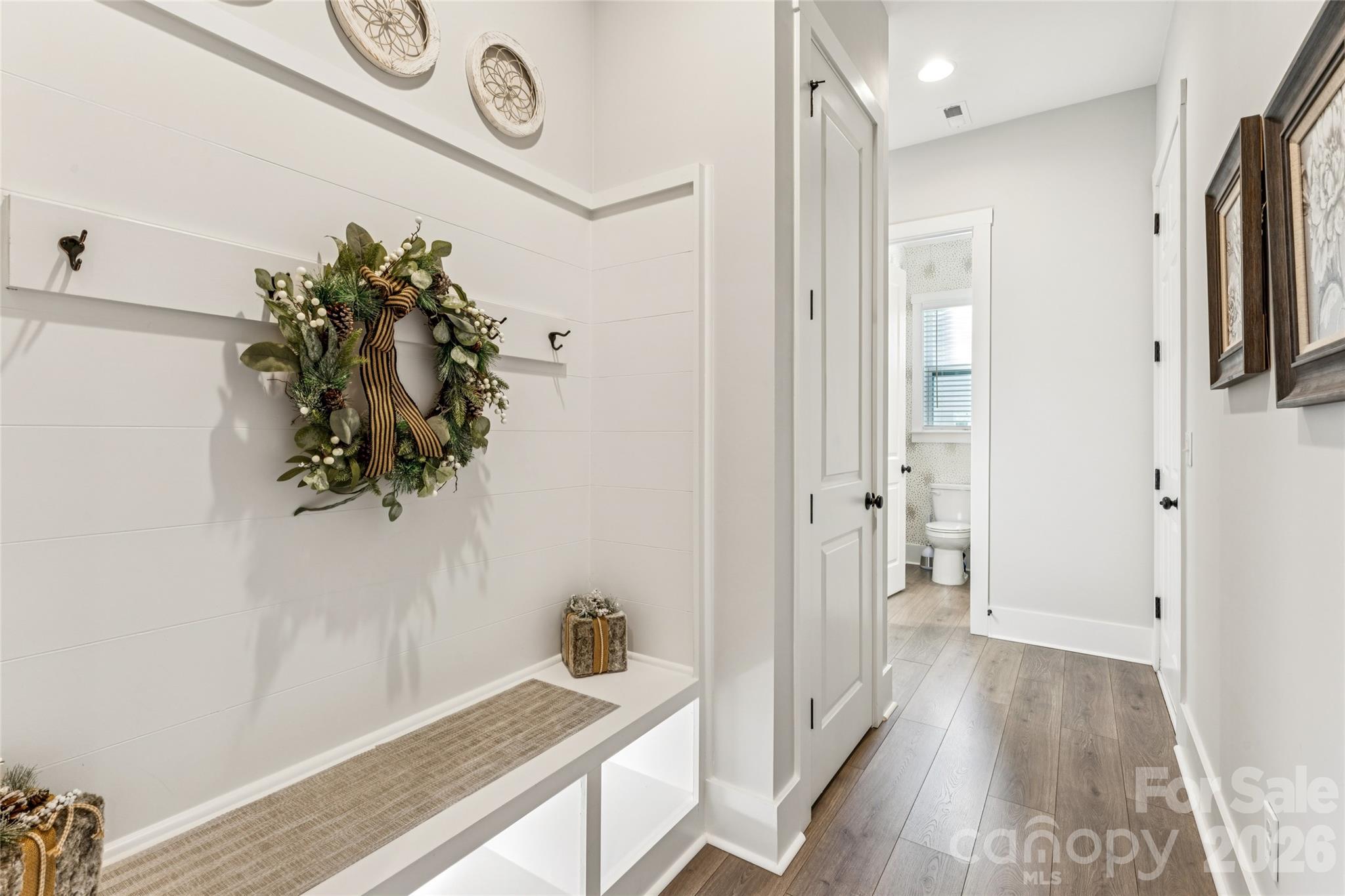 7822 Russell Road Indian Trail, NC 28079 - Photo 22 of 48 a view of a hallway with wooden floor and staircase