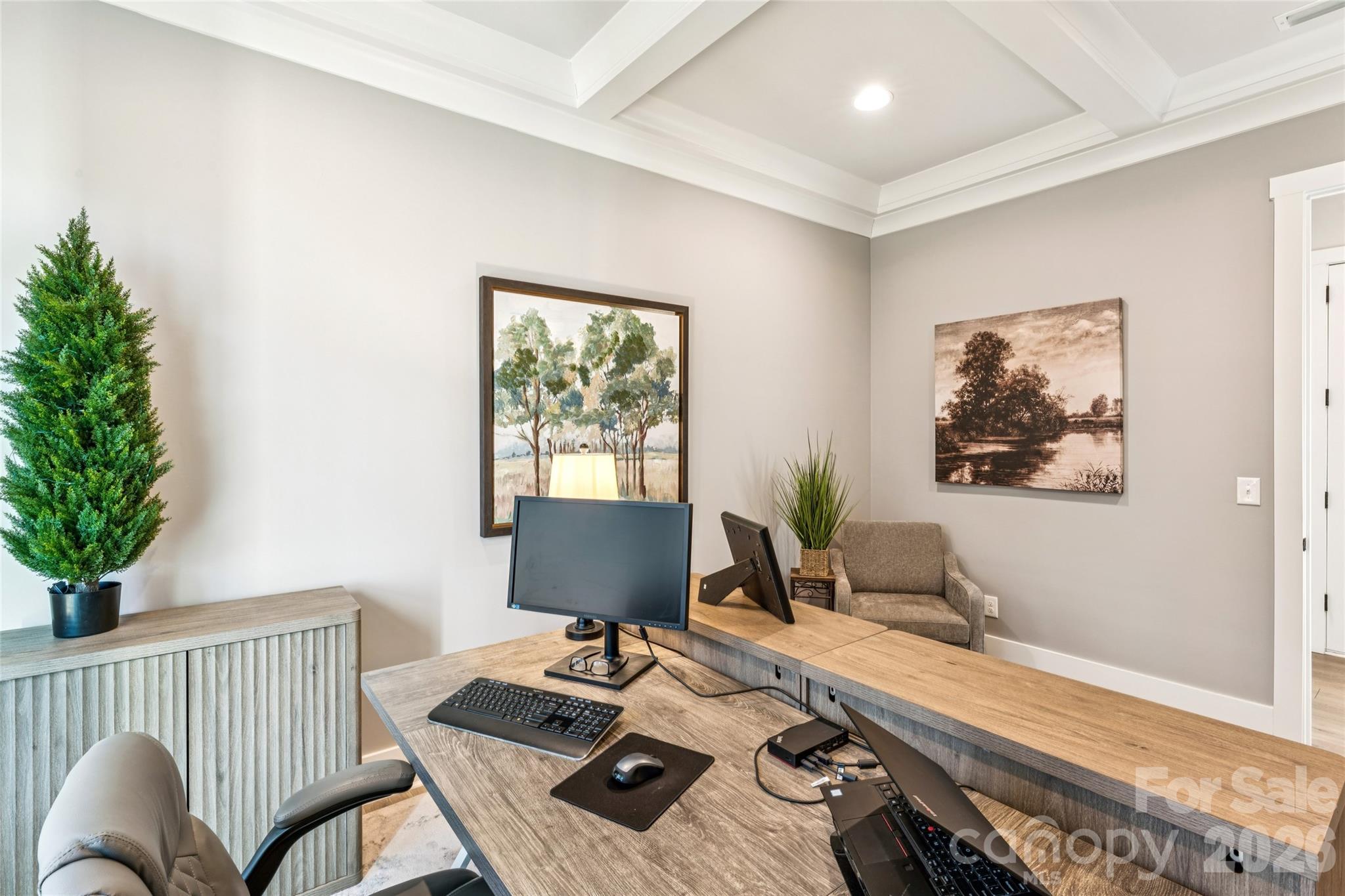 7822 Russell Road Indian Trail, NC 28079 - Photo 24 of 48 a view of a workspace with furniture and a potted plant