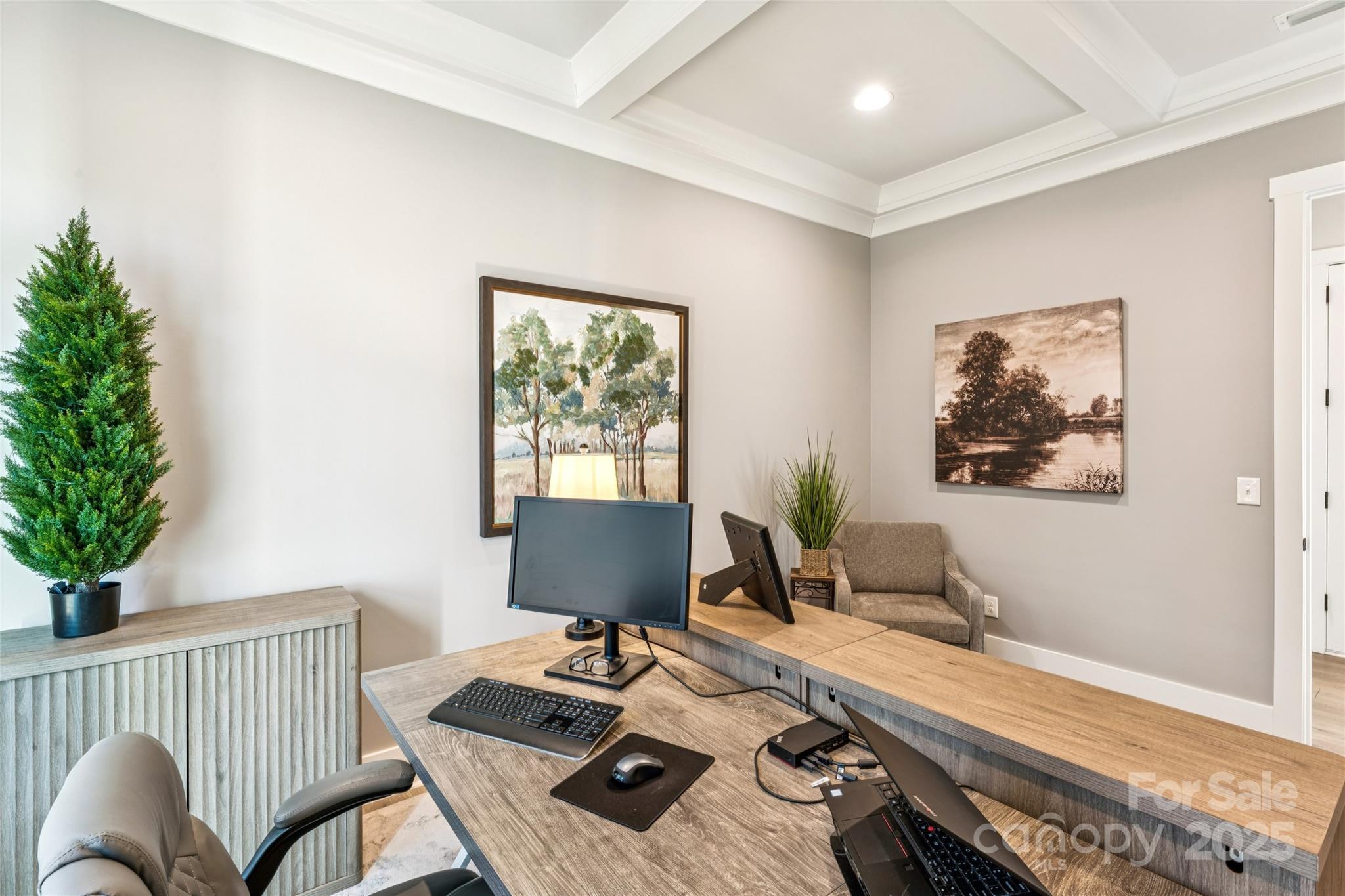 7822 Russell Road Indian Trail, NC 28079 - Photo 25 of 48 a view of a workspace with furniture and a potted plant