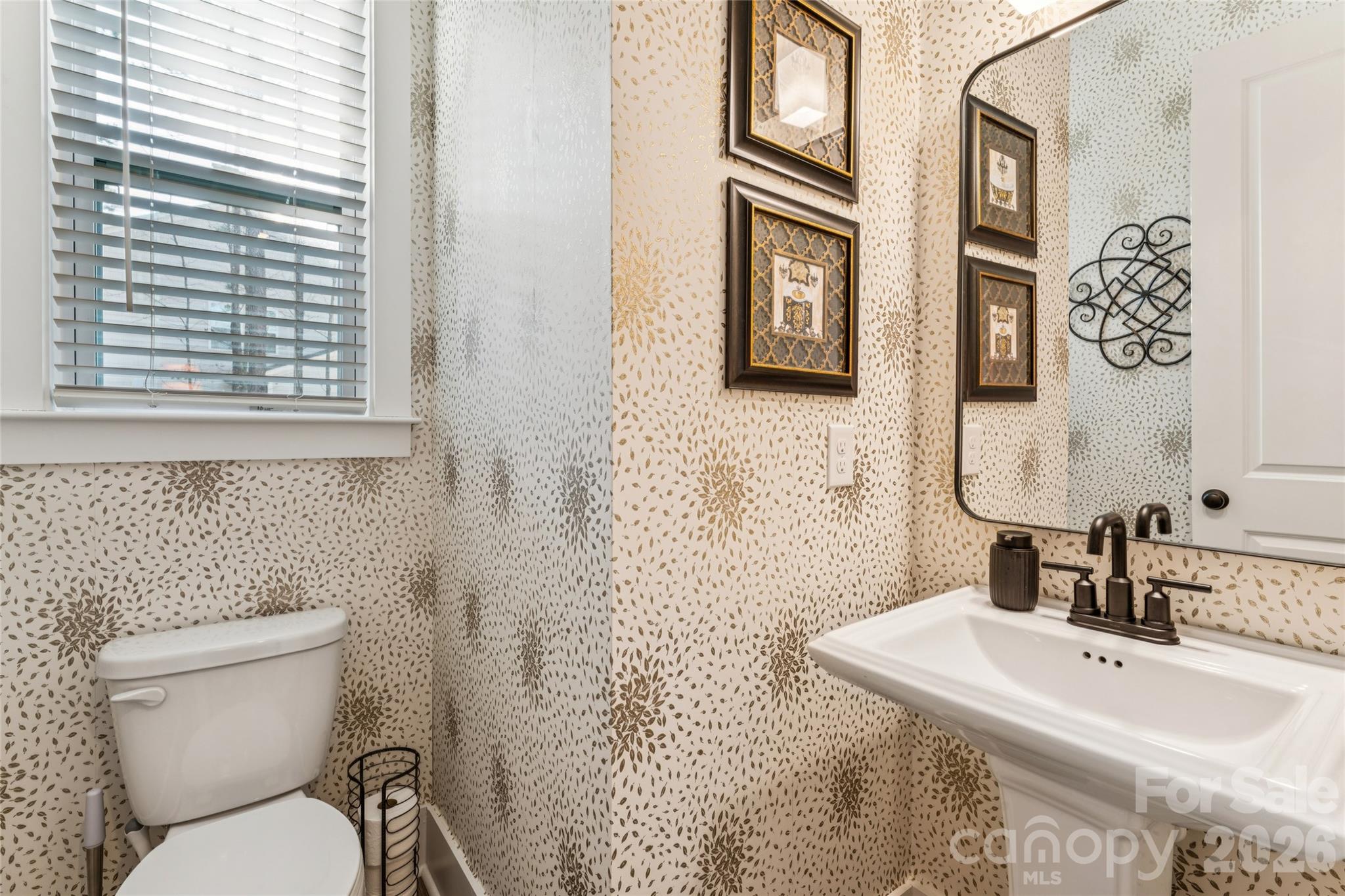 7822 Russell Road Indian Trail, NC 28079 - Photo 25 of 48 a bathroom with a toilet sink and mirror