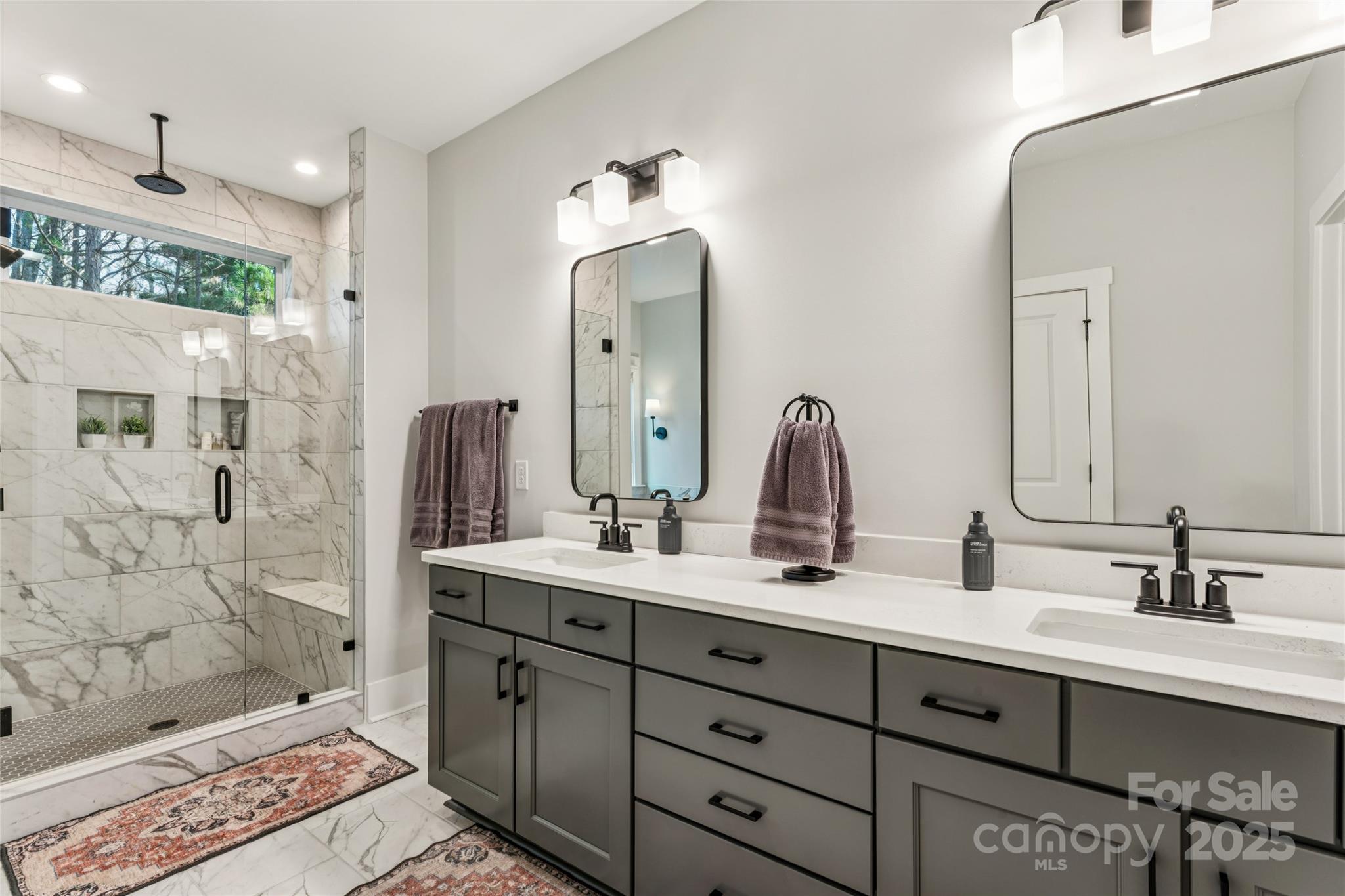 7822 Russell Road Indian Trail, NC 28079 - Photo 34 of 48 a bathroom with a double vanity sink mirror and shower