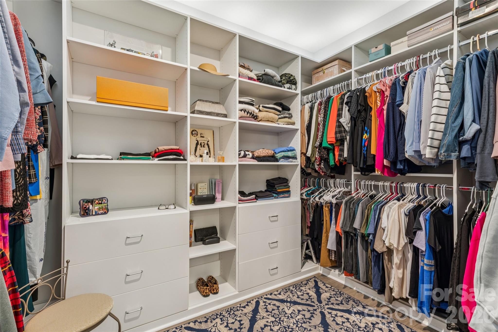 7822 Russell Road Indian Trail, NC 28079 - Photo 36 of 48 a view of walk in closet with clothes and shoes