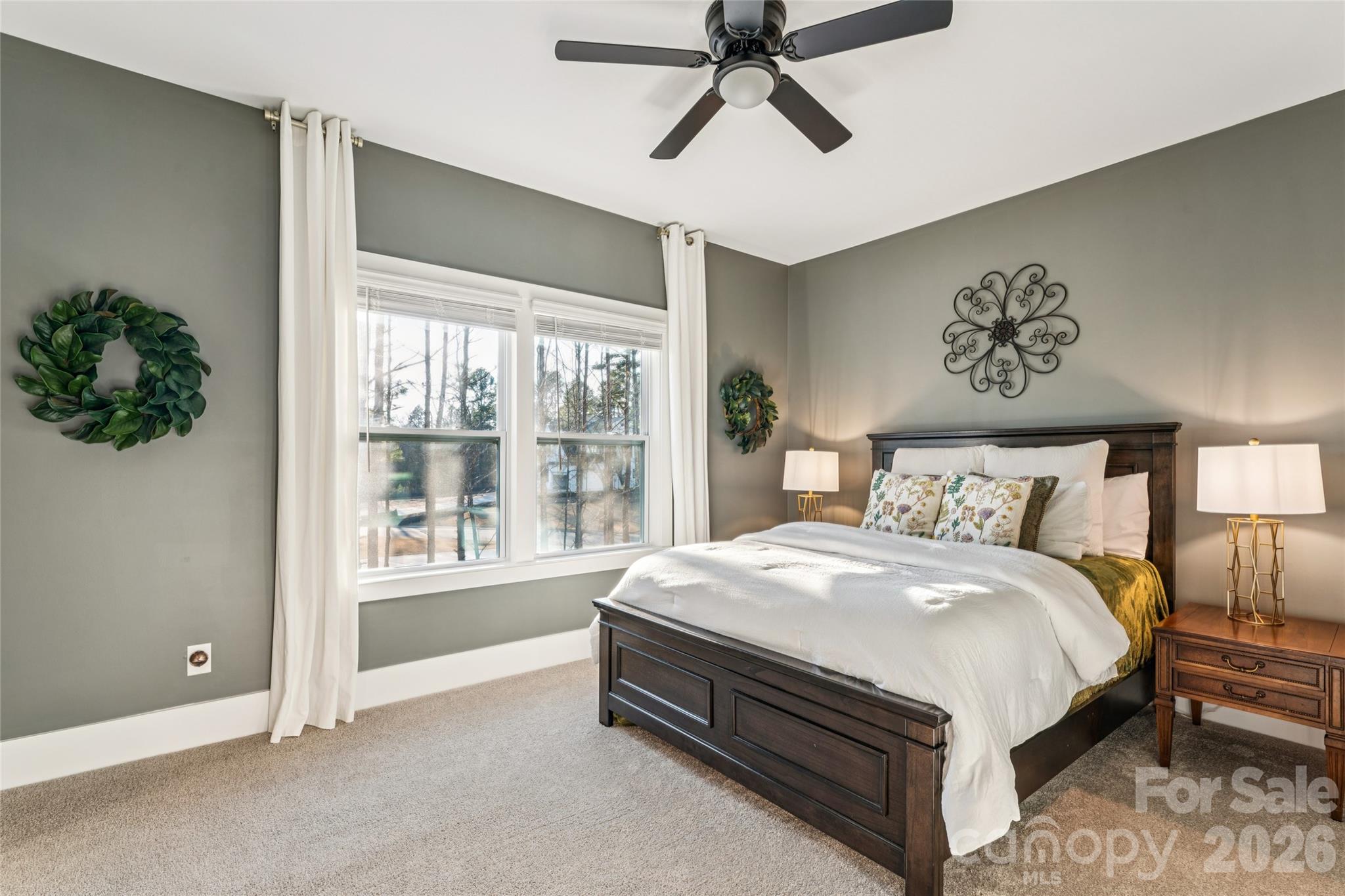 7822 Russell Road Indian Trail, NC 28079 - Photo 40 of 48 a spacious bedroom with a bed and a window