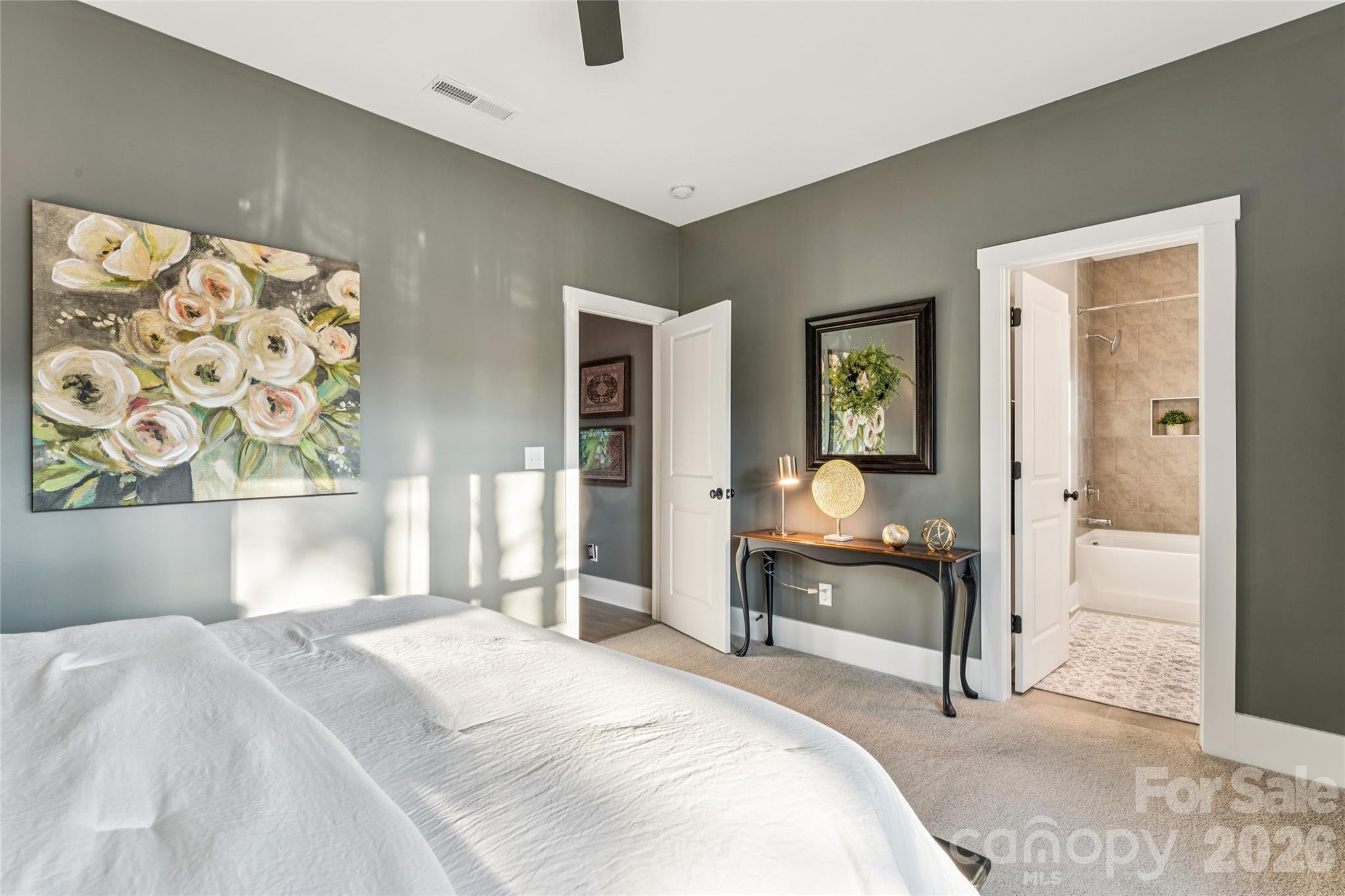 7822 Russell Road Indian Trail, NC 28079 - Photo 41 of 48 a bedroom with a bed and a painting on the wall