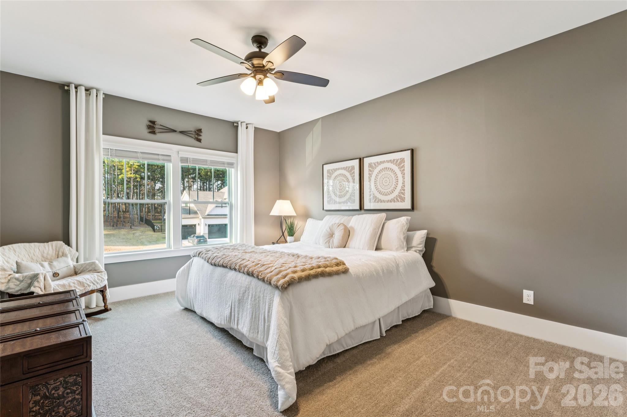 7822 Russell Road Indian Trail, NC 28079 - Photo 45 of 48 a spacious bedroom with a bed and a window