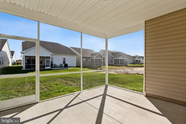a view of an house with backyard and balcony