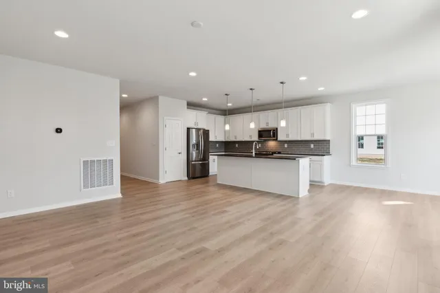 a view of kitchen with wooden floor