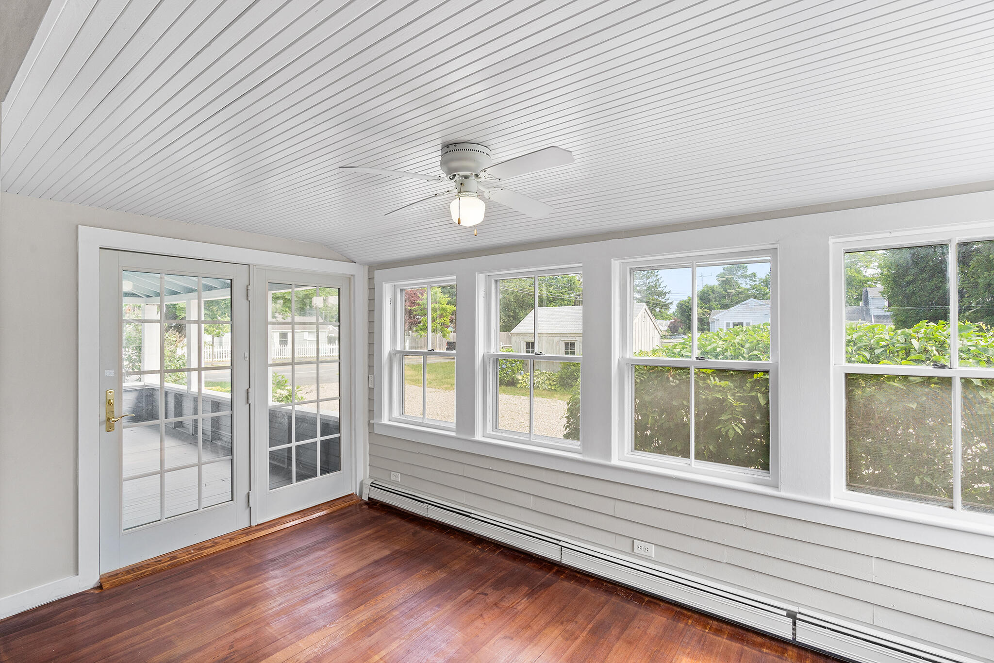 93 Sea Street Hyannis, MA 02601 - Photo 13 of 30 a view of an empty room with a window and wooden floor