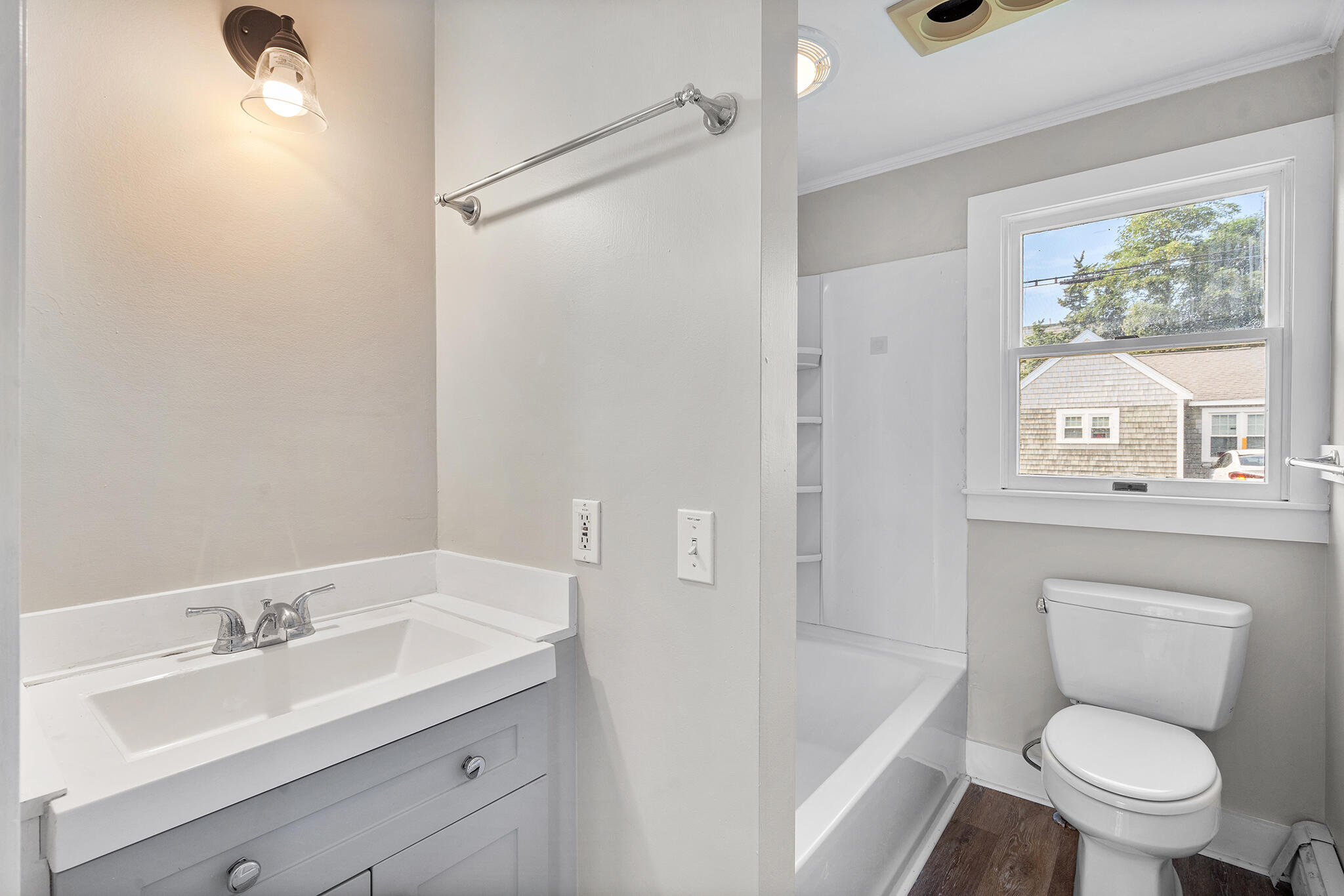 93 Sea Street Hyannis, MA 02601 - Photo 17 of 30 a bathroom with a sink toilet a large mirror and shower