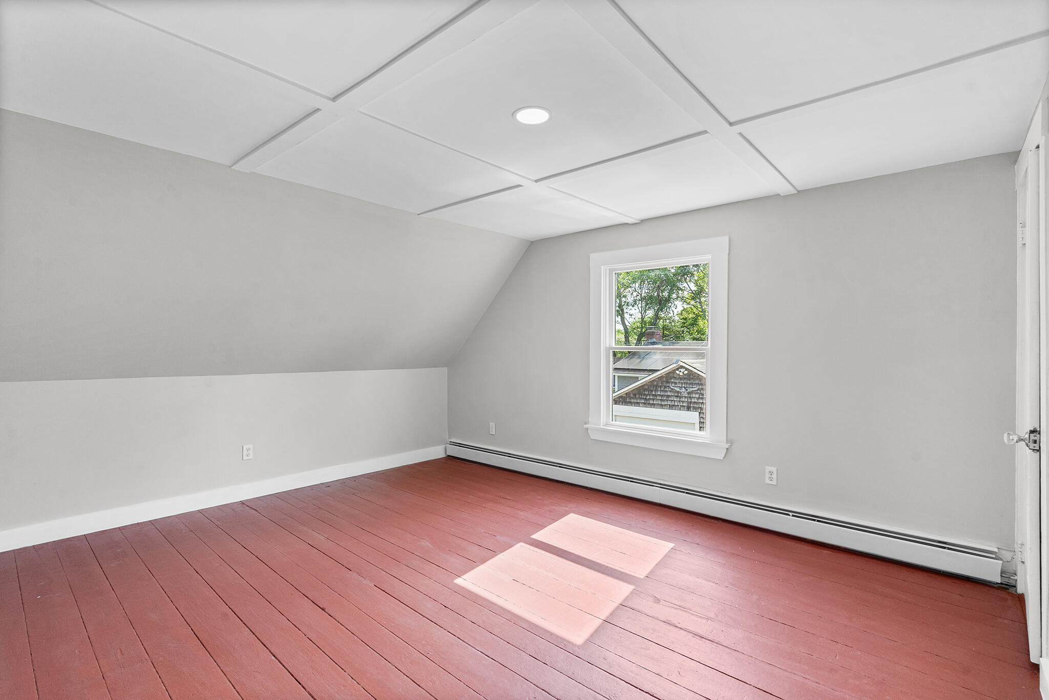 93 Sea Street Hyannis, MA 02601 - Photo 20 of 30 an empty room with wooden floor and windows
