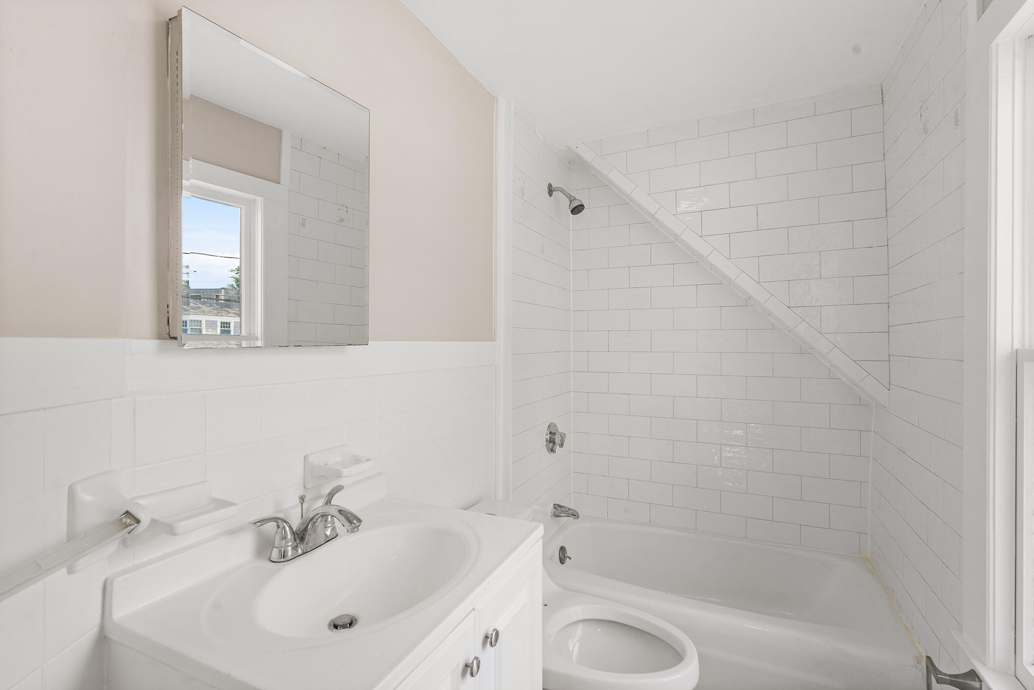 93 Sea Street Hyannis, MA 02601 - Photo 24 of 30 a bathroom with a sink a toilet and shower