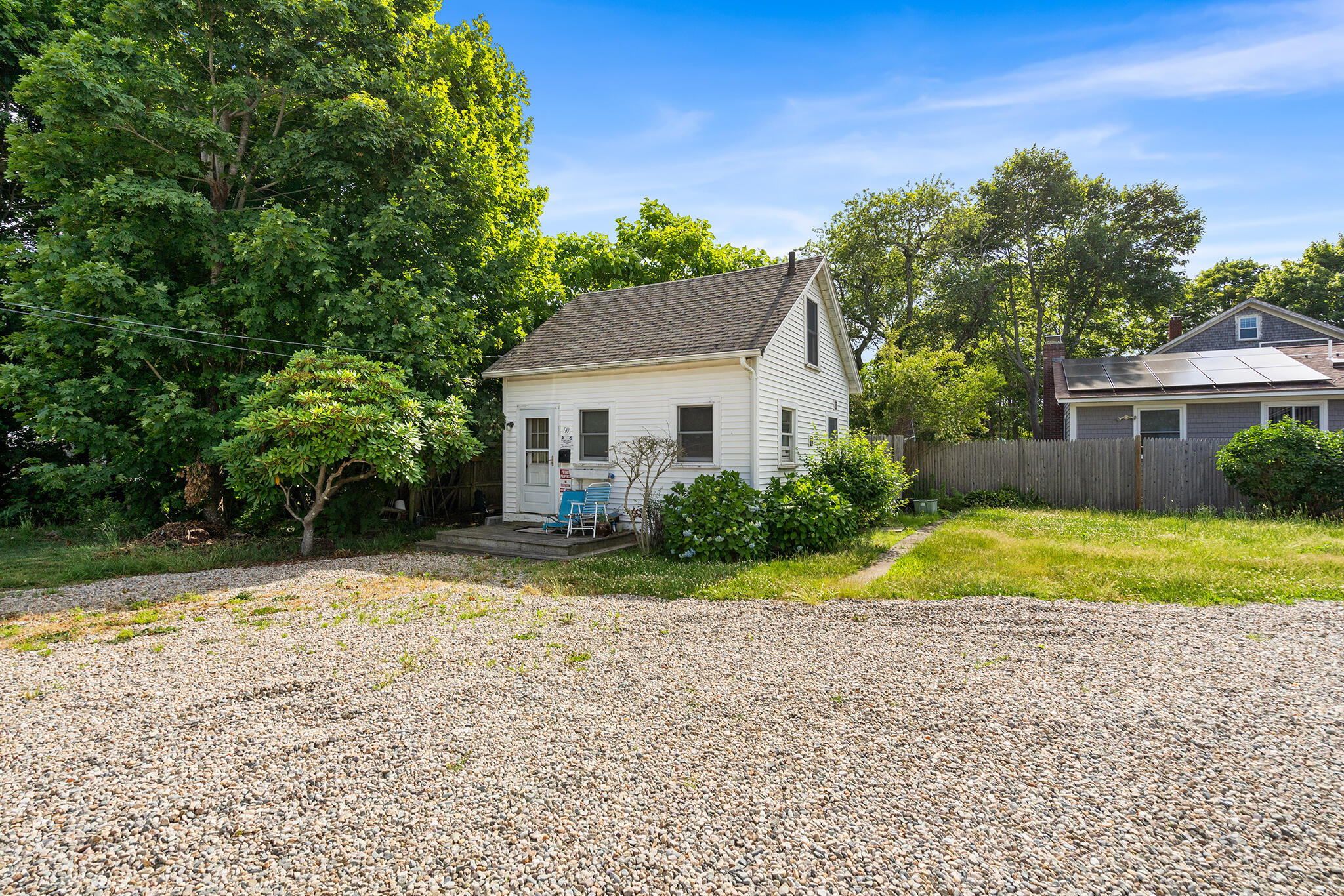 93 Sea Street Hyannis, MA 02601 - Photo 27 of 30 a front view of a house with a yard and trees
