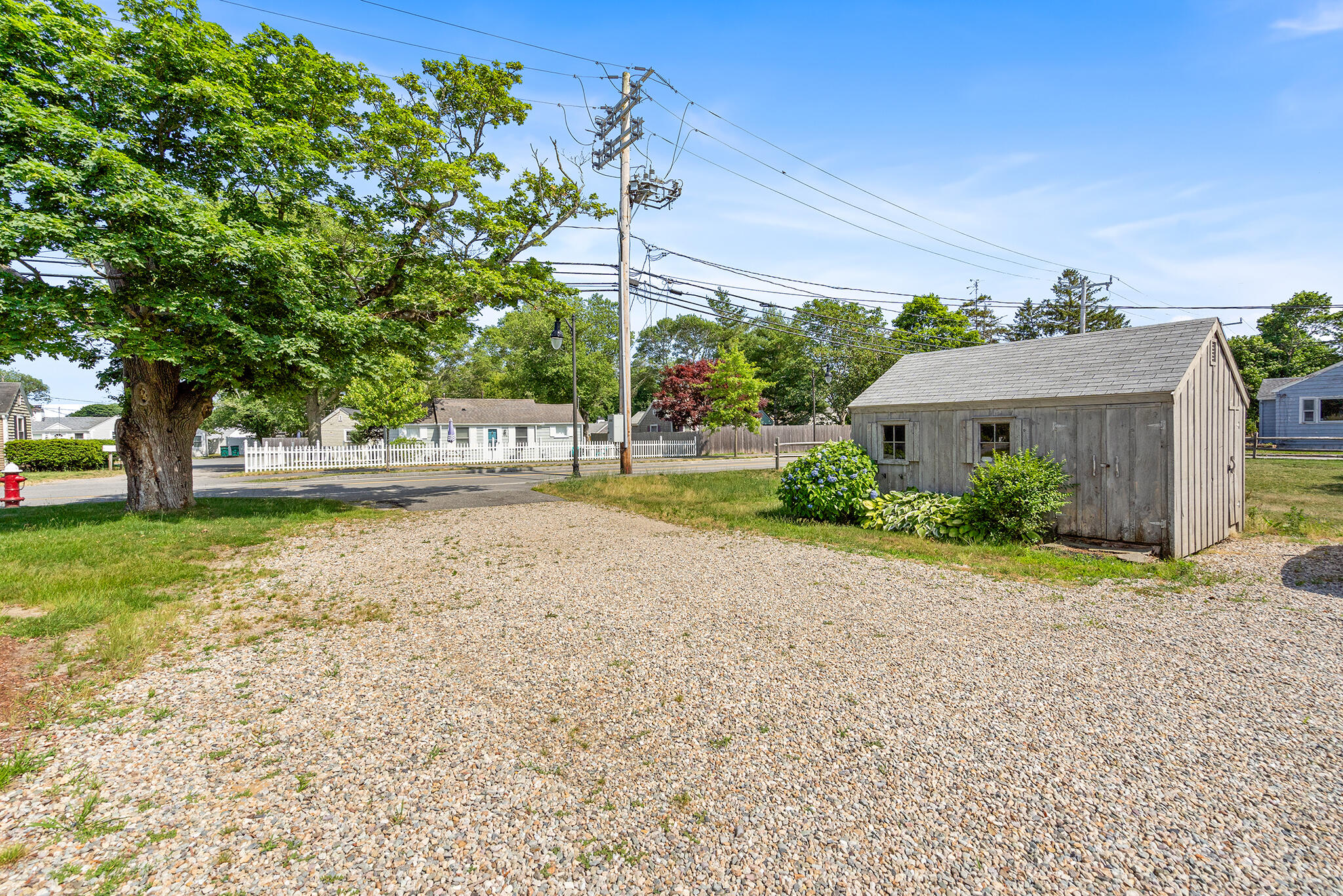 93 Sea Street Hyannis, MA 02601 - Photo 28 of 30 a front view of a house with a yard