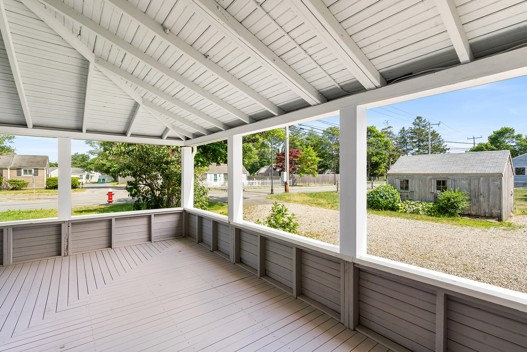93 Sea Street Hyannis, MA 02601 - Photo 4 of 30 a view of a porch with furniture and garden