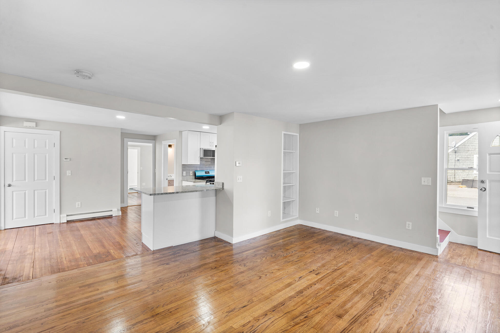 93 Sea Street Hyannis, MA 02601 - Photo 7 of 30 a view of a kitchen with wooden floor and a sink