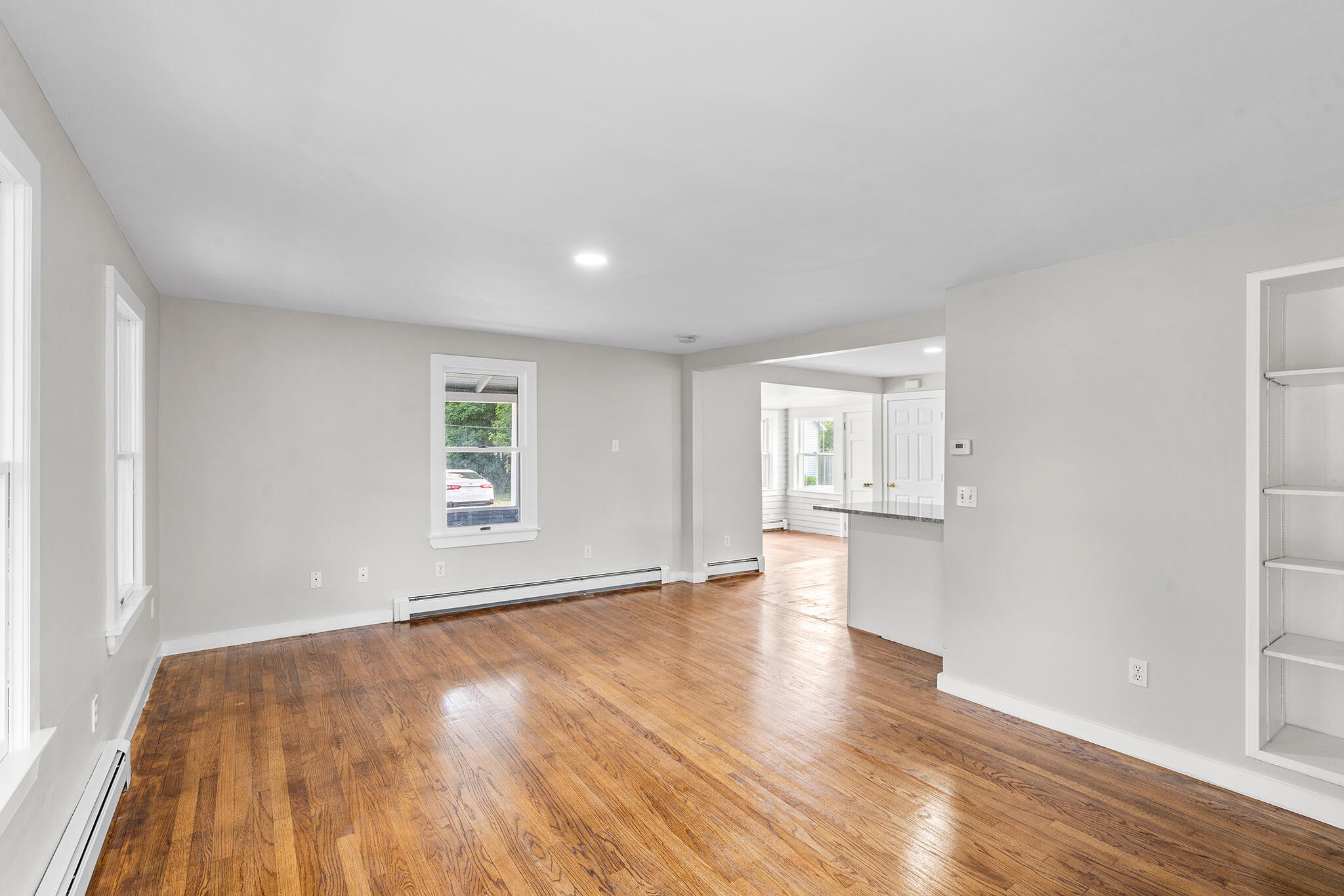93 Sea Street Hyannis, MA 02601 - Photo 8 of 30 a view of empty room with wooden floor and fan
