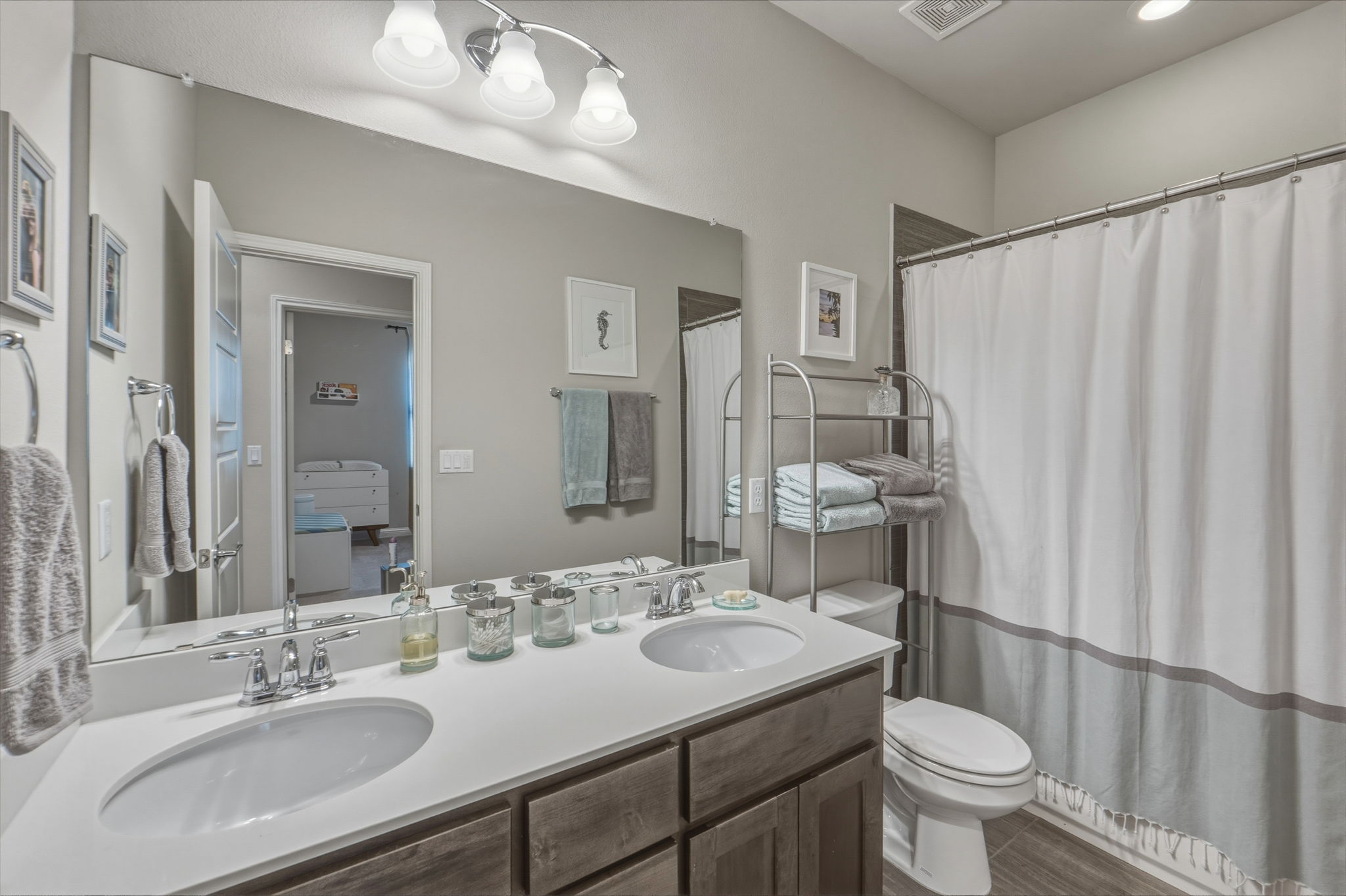 6814 East Riverside Drive, Unit 34 Austin, TX 78741 - Photo 25 of 26 a bathroom with a sink toilet and shower
