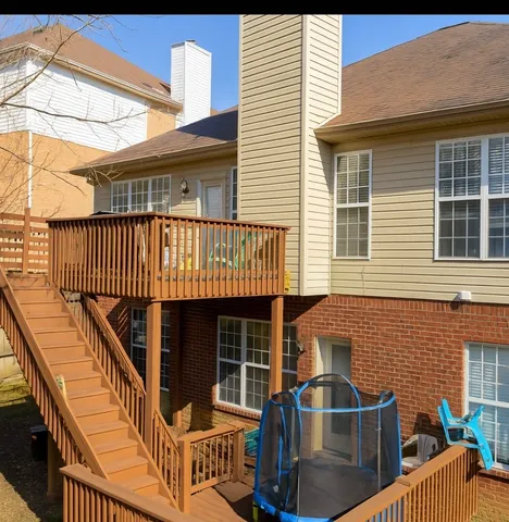 a front view of a house with iron stairs