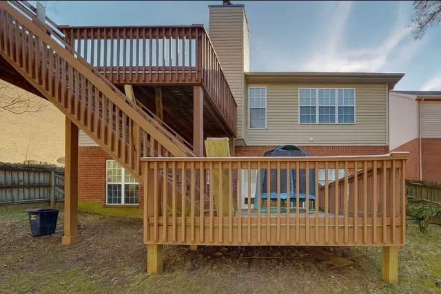 a view of staircase with large window and stairs