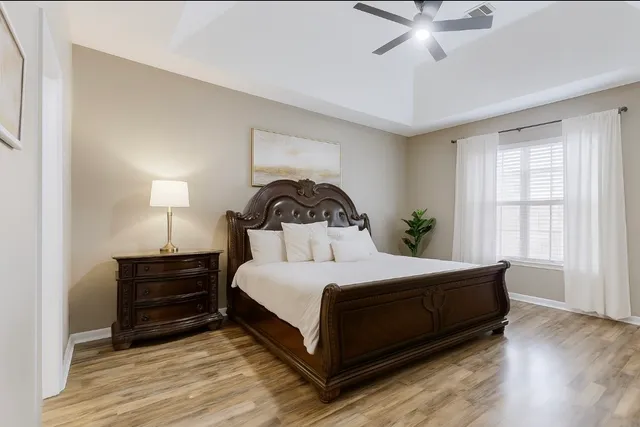 a bedroom with a bed and window