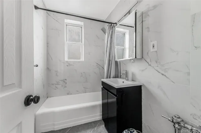 a bathroom with a sink and a shower
