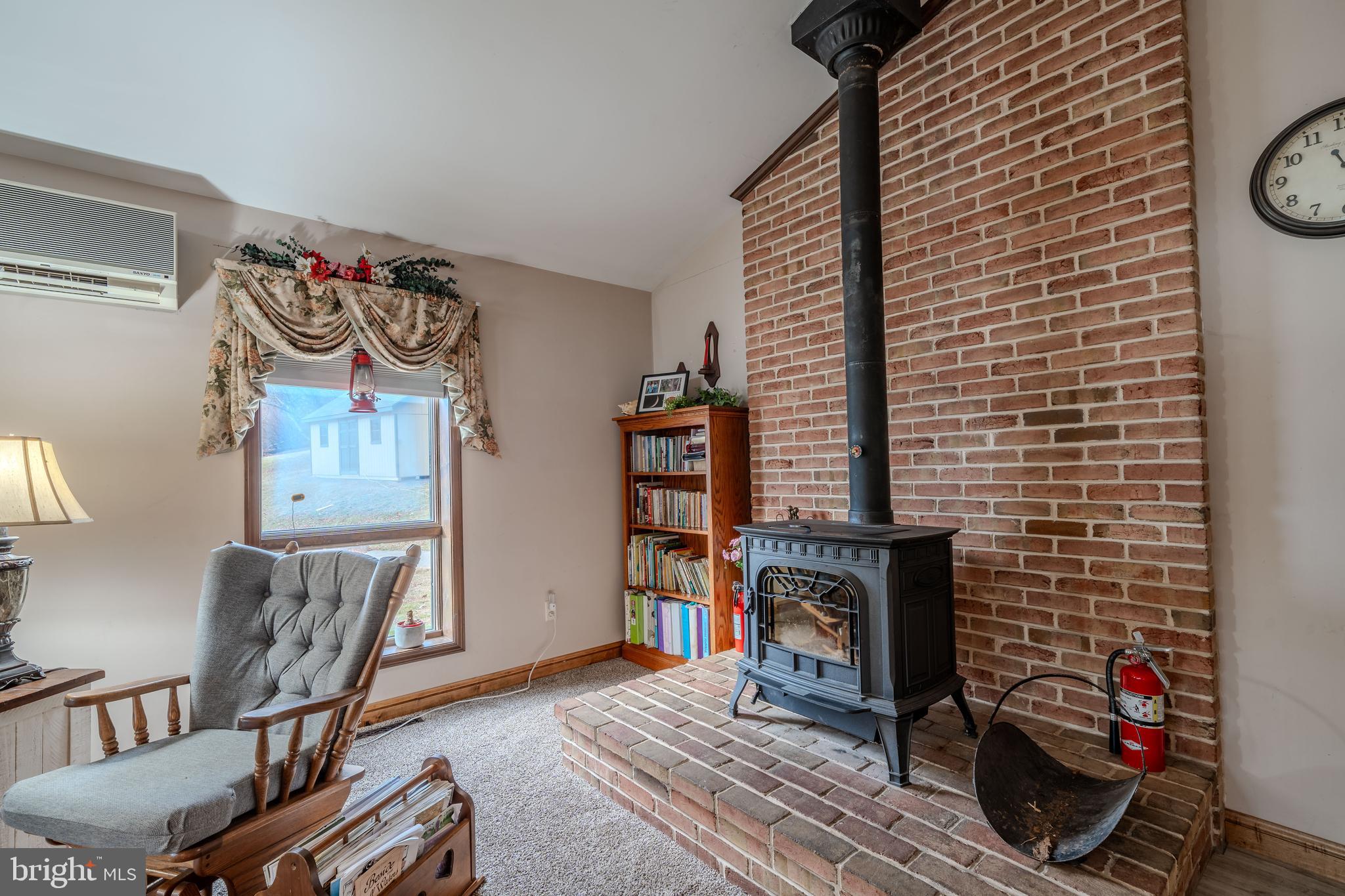 338 Culp Road Sunbury, PA 17801 - Photo 15 of 43 a living room with furniture and a fireplace
