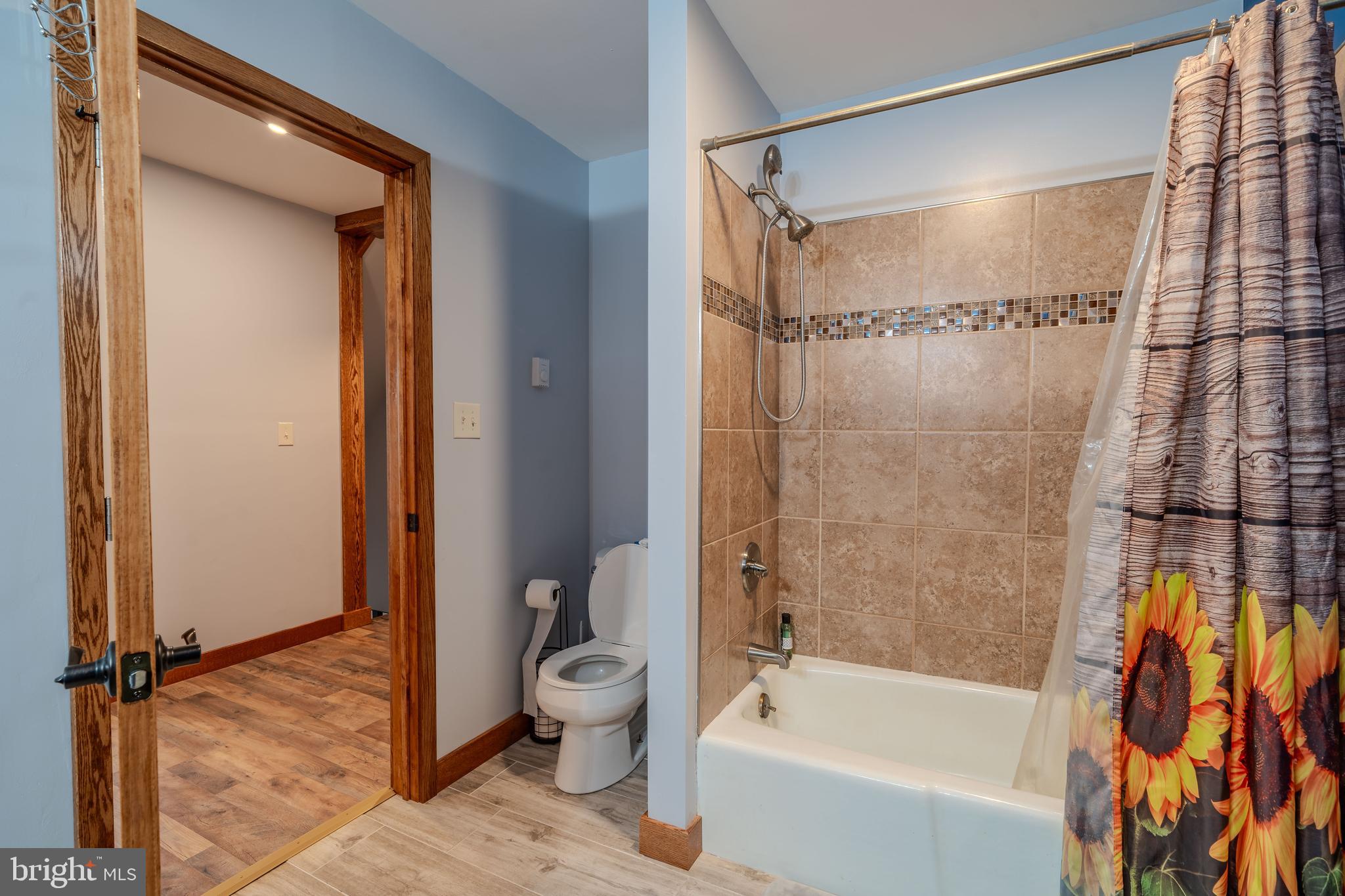 338 Culp Road Sunbury, PA 17801 - Photo 26 of 43 a bathroom with a granite countertop bathtub shower and toilet