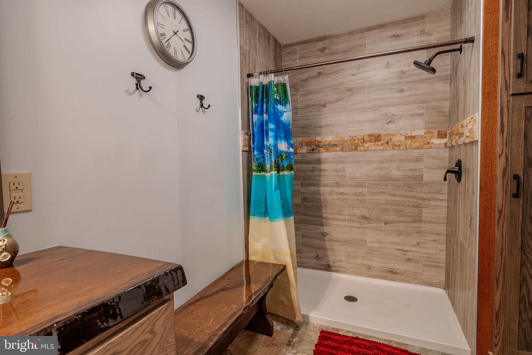 338 Culp Road Sunbury, PA 17801 - Photo 35 of 43 a bathroom with a bathtub and a shower