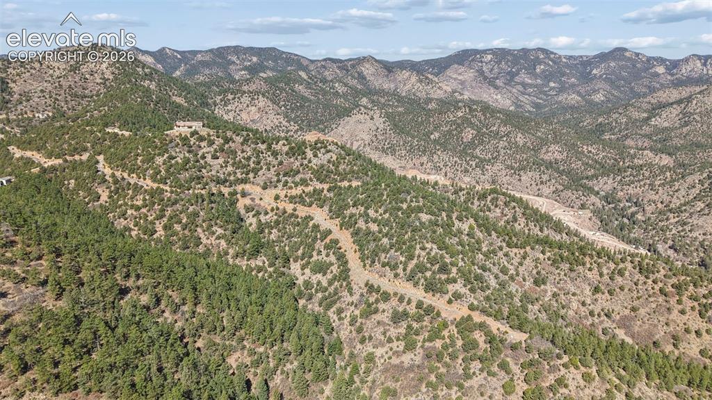 Turkey Canon Ranch Road Colorado Springs, CO 80926 - Photo 14 of 20 view of a mountain range with a lush green hillside