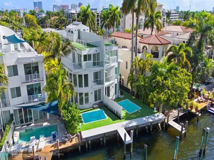 a view of yard with swimming pool and green space