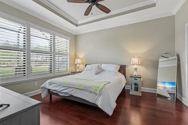 a living room with window and a flat screen tv