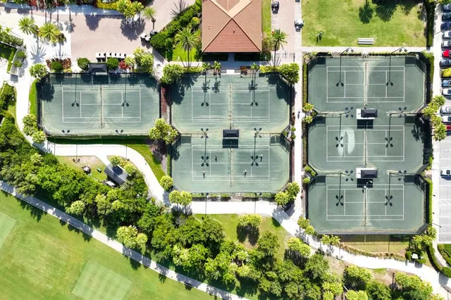 a view of a patio with table and chairs potted plants with wooden floor