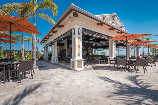 a view of a patio with couches and a fire pit