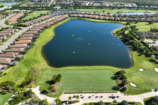 an aerial view of a house a garden and swimming pool