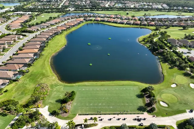 an aerial view of a house a garden and swimming pool