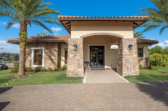 an aerial view of residential houses with outdoor space and river view