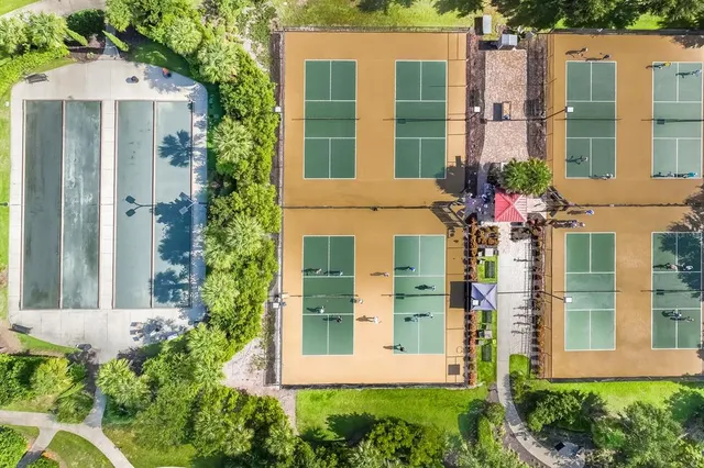 a very nice looking living room with a large window and wooden floor