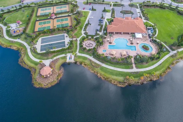 a view of a park with iron fence
