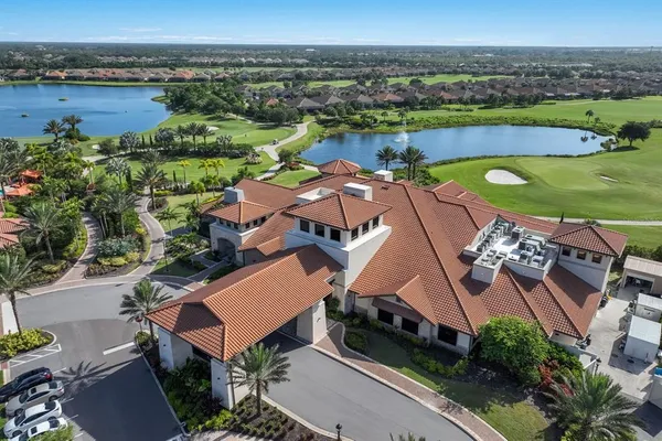 a backyard of a house with lots of green space and fountain