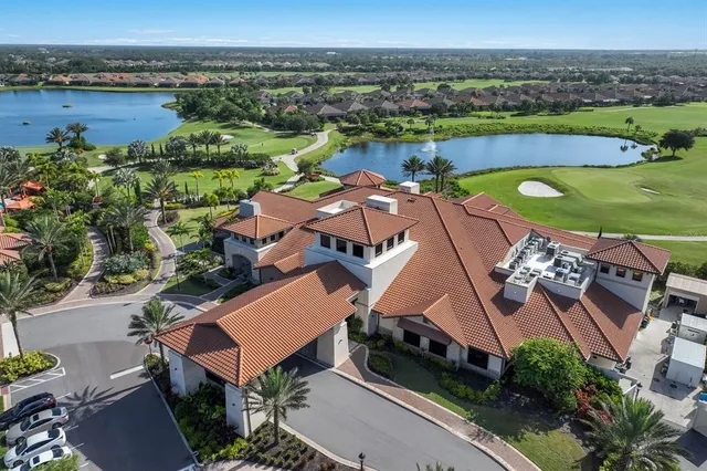 a backyard of a house with lots of green space and fountain