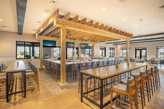 a view of a golf course with a wooden fence