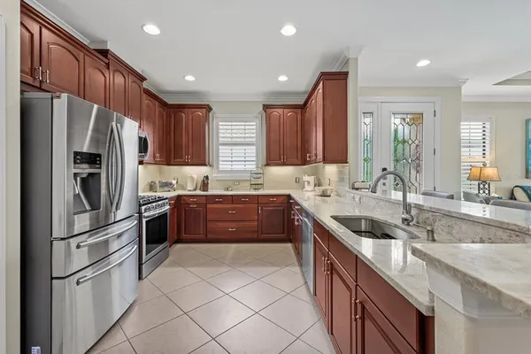 a view of a dining room with furniture and chandelier