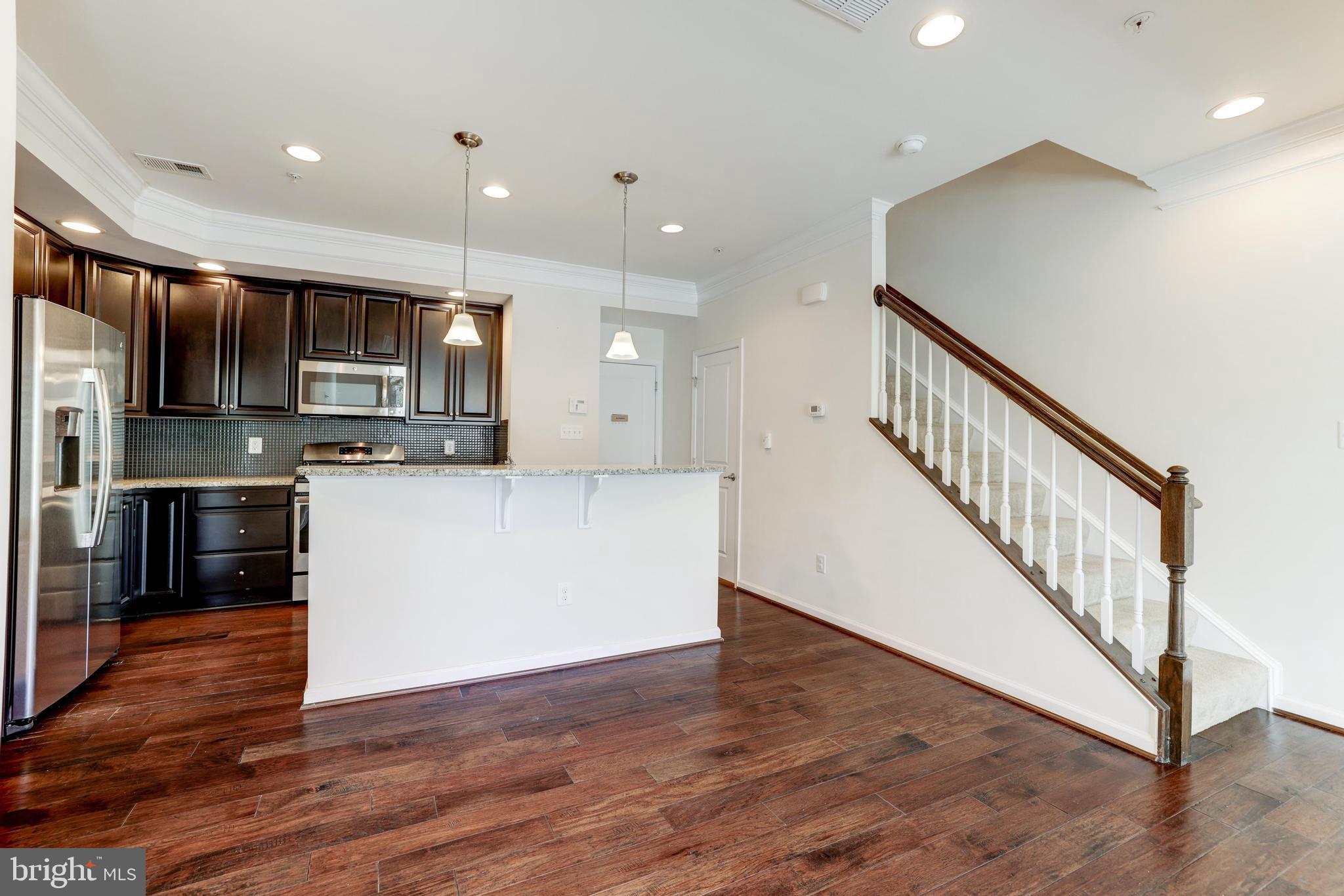 13643 Air And Parkway, Unit MUSEUM 9L Herndon, VA 20171 - Photo 12 of 45 a view of kitchen with microwave and stove