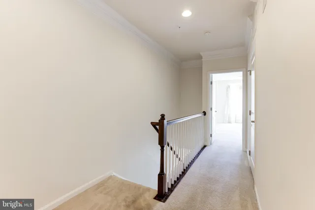 a view of a hallway with a white walls